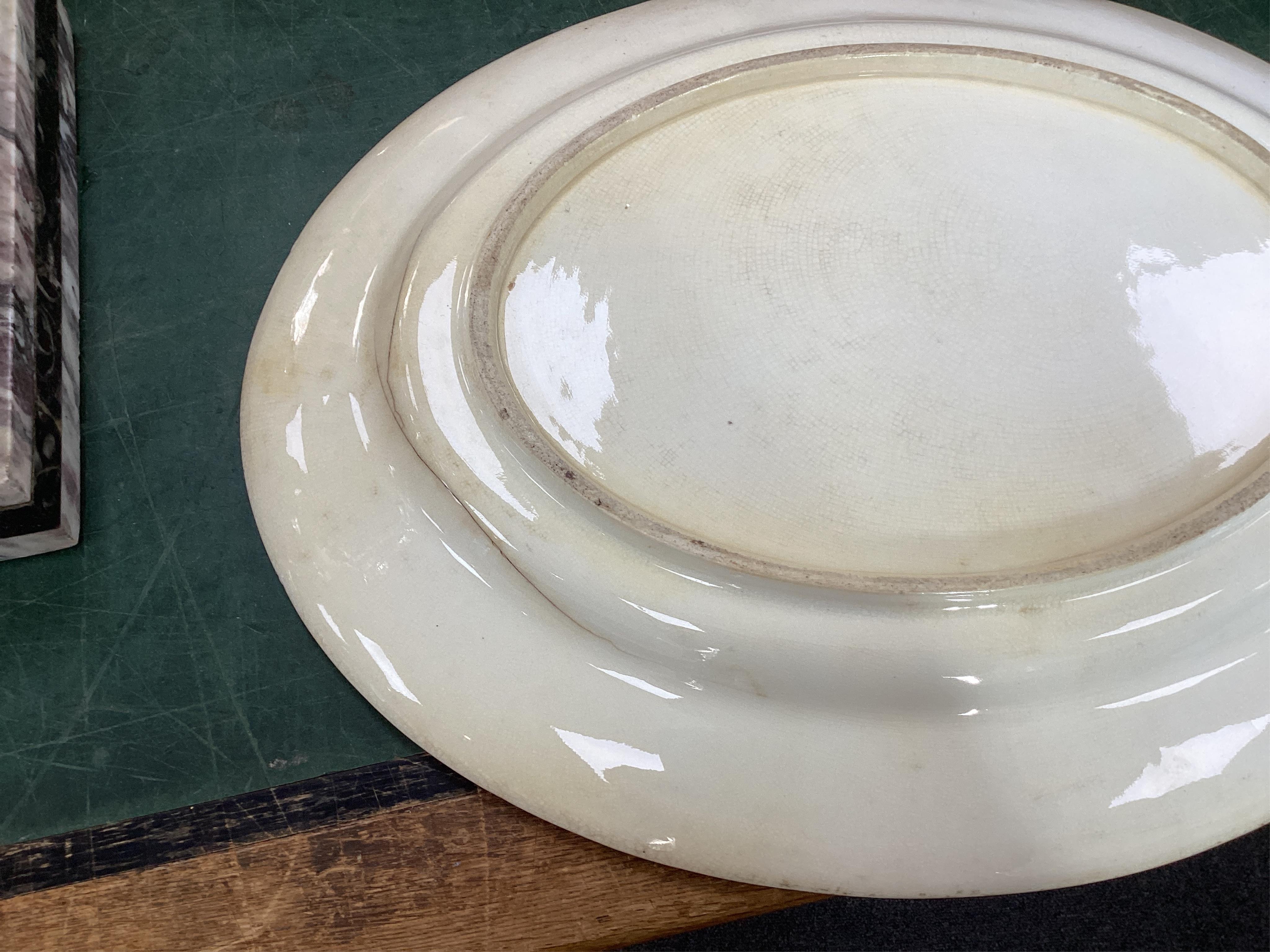 A Coalport bird painted part dinner service, mid 19th century